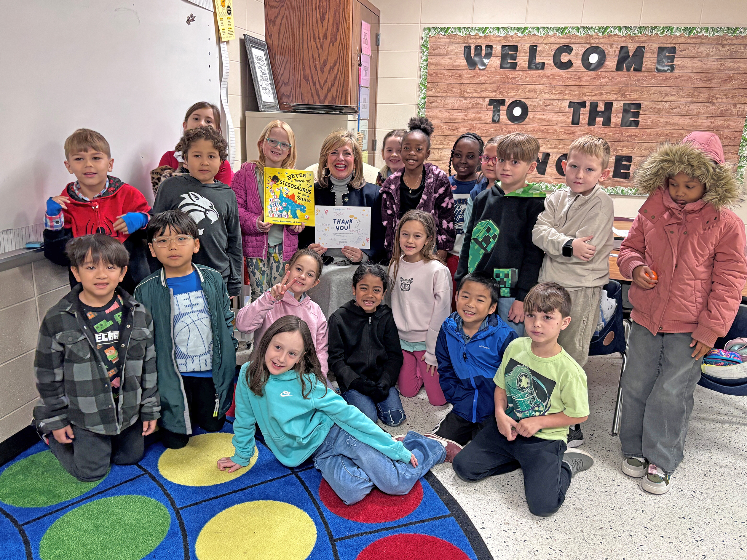 Board Chair Cecilia Russo Turner reads to a classroom